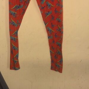 LuLaRoe Red Leggings with Blue Dinosaur Pattern